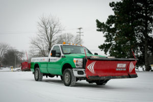 TLC truck with front end and rear end plows